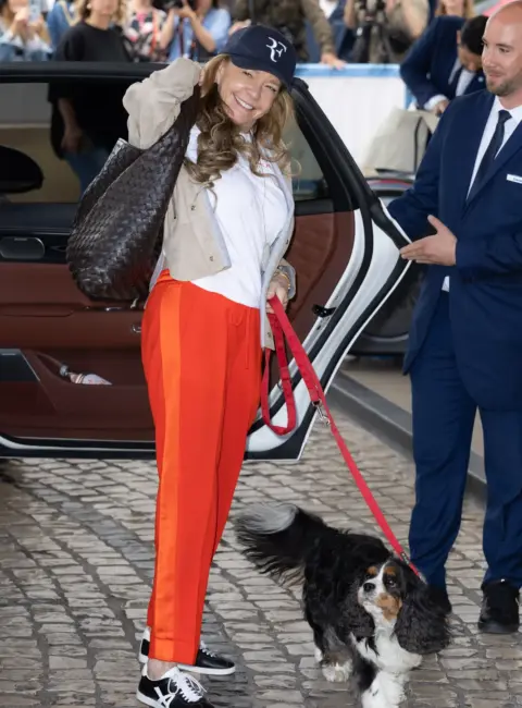 Caroline Scheufele and Their Adorable Dog at the 78th Cannes Film Festival 05-12-25