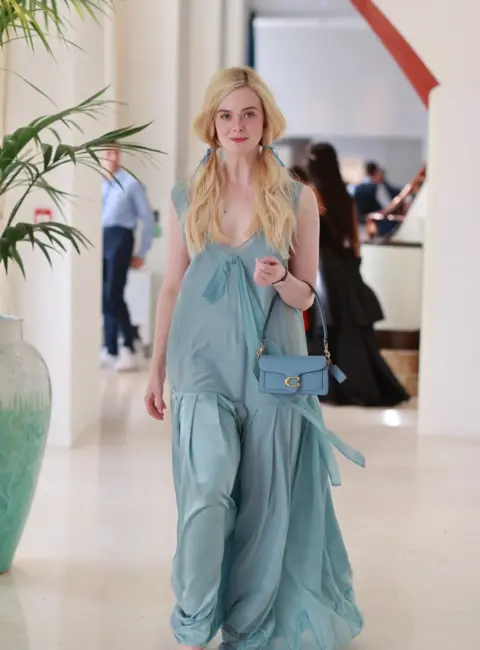 Elle Fanning Shines in Stunning Blue Outfit at Cannes Film Festival 05-21-25