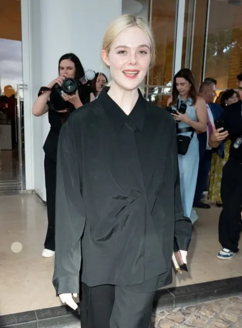 Elle Fanning Stuns in Black Outside Hotel Martinez at Cannes Film Festival 05-22-25