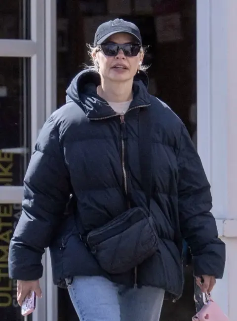 Holly Willoughby Rocks Navy Katharine Hamnett ‘LOVE’ Puffer in 18C Weather While Walking Her Dog 05-09-25