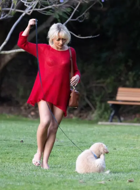 Sabrina Carpenter Stuns in Red Dress at Hollywood Hills Park with Leggy Look and Adorable Dog in Tow 05-21-25