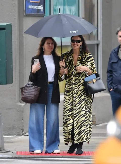Irina Shayk Takes a Casual Stroll with Friends Through the Streets of New York City 06-15-25