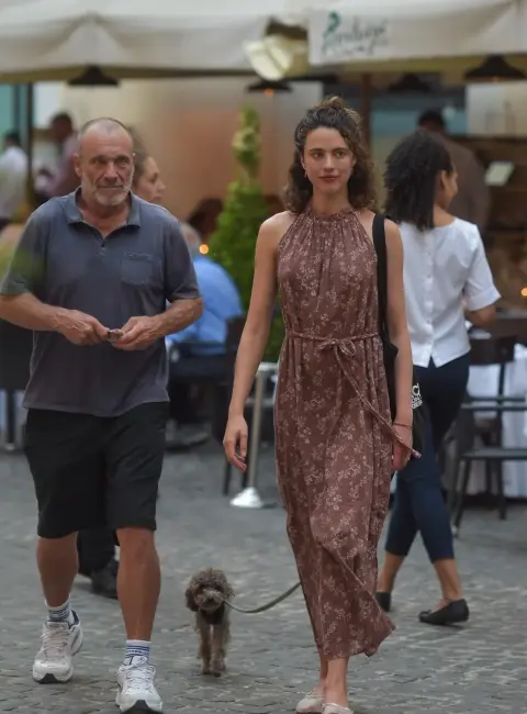 Margaret Qualley Shines in Pink Floral Dress Alongside Her Father and Furry Friend in Rome 06-23-25