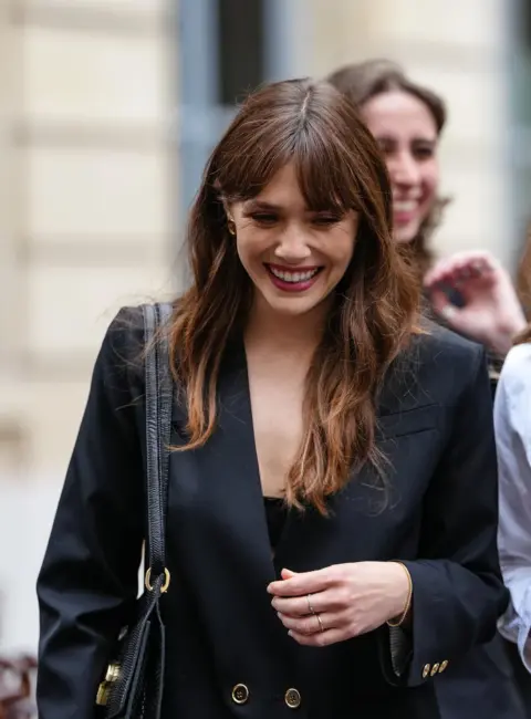 Elizabeth Olsen Attends the Patou Fashion Show in Paris, France 07-06-25