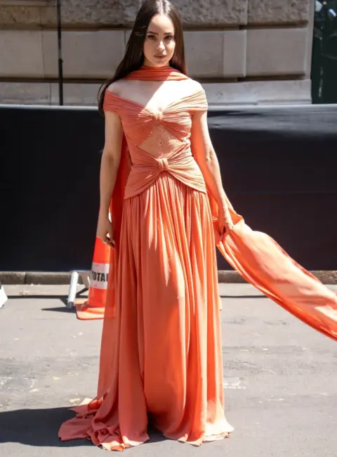 Sofia Carson Stuns in Salmon Dress at Elie Saab Show in Paris 07-09-25