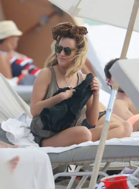 Caroline Flack Enjoys the Morning Sun at the Beach in Miami Beach 12-28-15