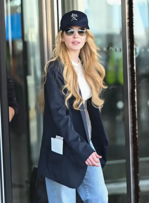 Lindsay Lohan and Family Touch Down at JFK Airport in NYC 08-15-2025