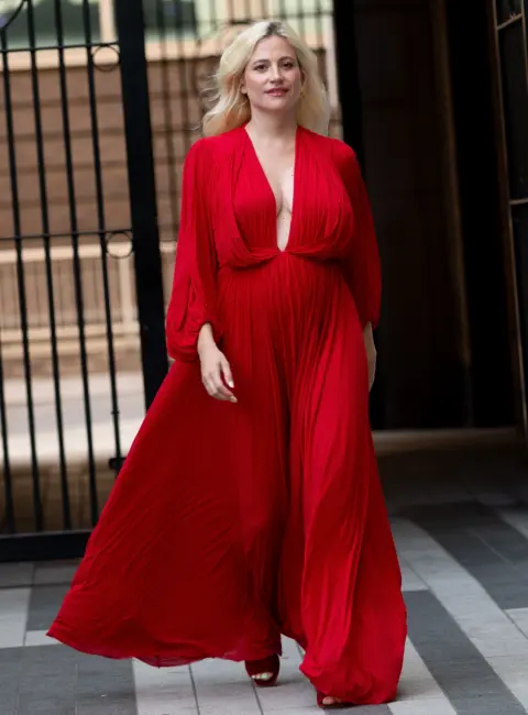 Pixie Lott Turns Heads in East London Wearing Stunning All Red Ensemble 08-12-2025
