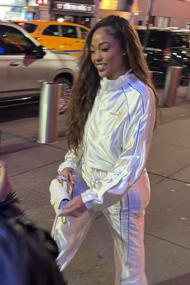 Jordyn Woods Turns Heads in Chic White Tracksuit at Knicks Game in NYC 10-24-2025