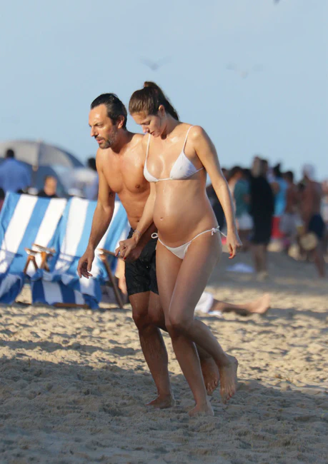 Nadejda Savcova Shows off Her Baby Bump in a White Bikini at the Beach in Miami Beach 01-01-2016