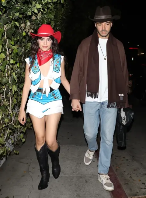 Camila Cabello and Henry Junior Chalhoub Arrive in Cowboy Style for Halloween Party in Los Angeles 10-31-2025